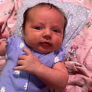 Luna joined the competition — help win amazing prizes! baby, bee_patch, cartoon, child, curious_expression, cute, daisy_pattern, face, hand, head, indoor, infant, lying_down, minnie_mouse, newborn, person, pink_blanket, purple_outfit, skin, soft_toy_pattern