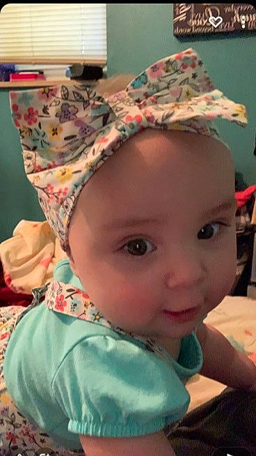 Kensington is registered to the contest to win money with this photo: baby, baby_toddler_clothing, cap, cheek, child, chin, cool, costume_hat, eyelash, fashion_accessory, fun, happy, headgear, helmet, iris, pattern, person, pink, skin, textile