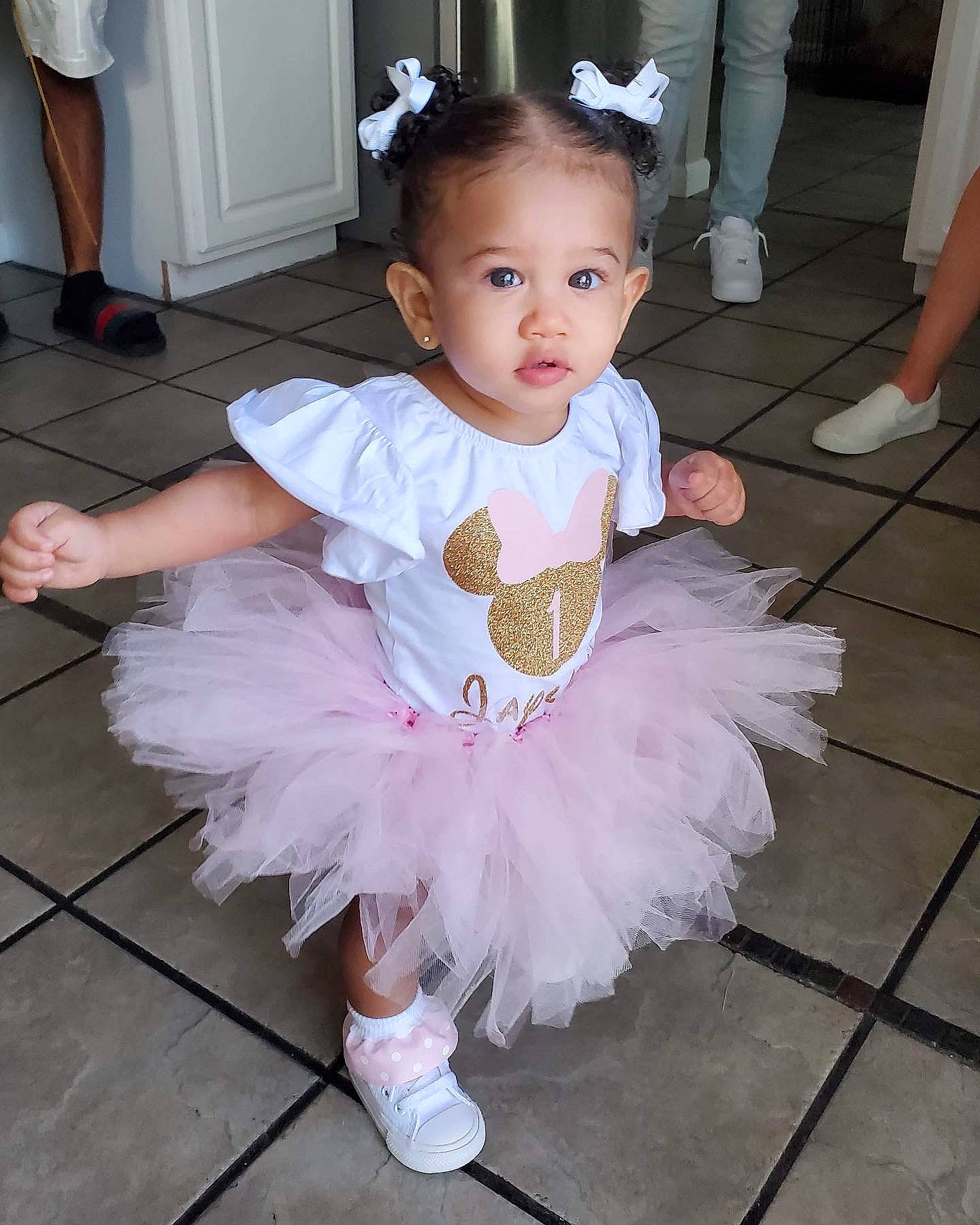 Jaylani joined the competition — help win amazing prizes! baby, baby_toddler_clothing, ballet_tutu, child, clothing, floor, footwear, happy, iris, joint, leg, organ, people, person, photograph, pink, shoe, skin, standing, toddler