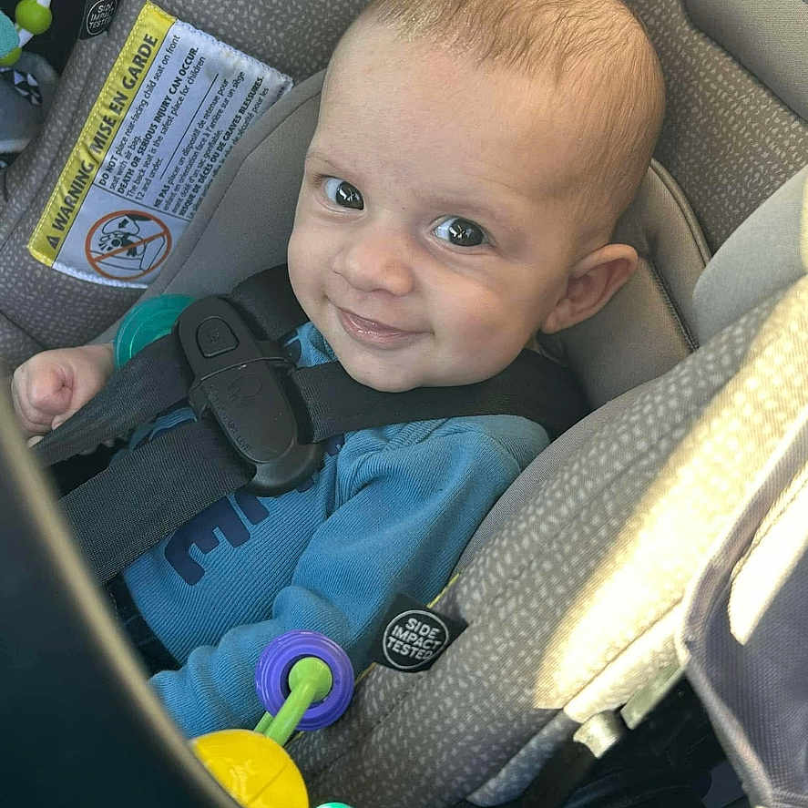 Zaidynn is registered to the contest to win money with this photo: accessories, baby, belt, bodypart, car, car_interior, crib, cushion, face, finger, furniture, hand, head, homedecor, infantbed, person, photography, portrait, transportation, vehicle