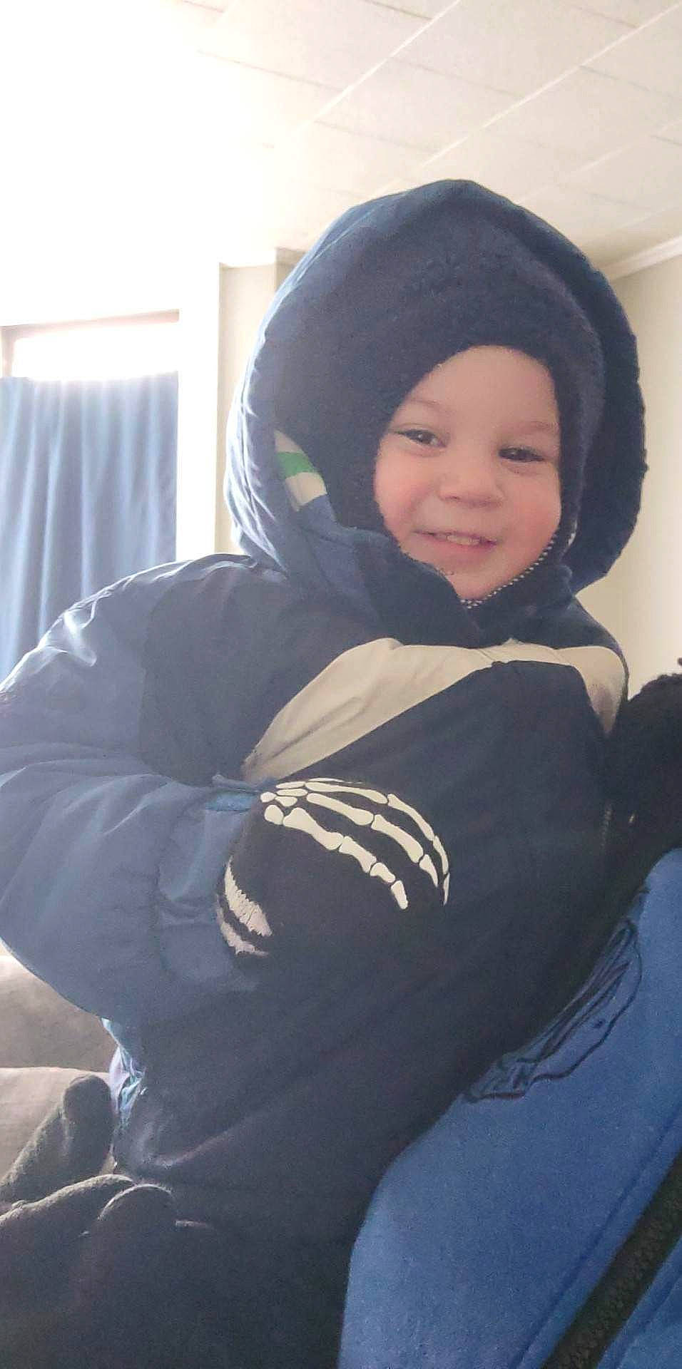 David joined the competition — help win amazing prizes! baby, baby_products, beanie, comfort, curtain, fun, happy, headgear, headwear, hood, hoodie, joy, knit_cap, person, personal_protective_equipment, sitting, sleeve, smile, toddler, tree