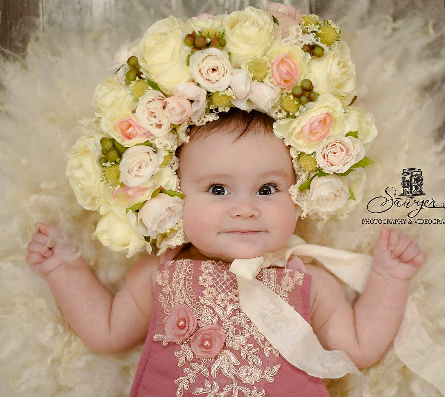 Olivia Grace joined the competition — help win amazing prizes! artificial_flower, baby, bouquet, child, child_model, cut_flowers, fashion_accessory, floral_design, floristry, flower, flower_arranging, hair_accessory, headgear, headpiece, person, petal, pink, plant, rose, smile