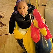 Ketsia a rejoint le concours — aidez-le/la à gagner de superbes lots ! amusementpark, animal, carousel, child, clothing, costume, face, female, footwear, girl, head, horse, indoors, outdoors, person, photography, play, playarea, portrait, shoe