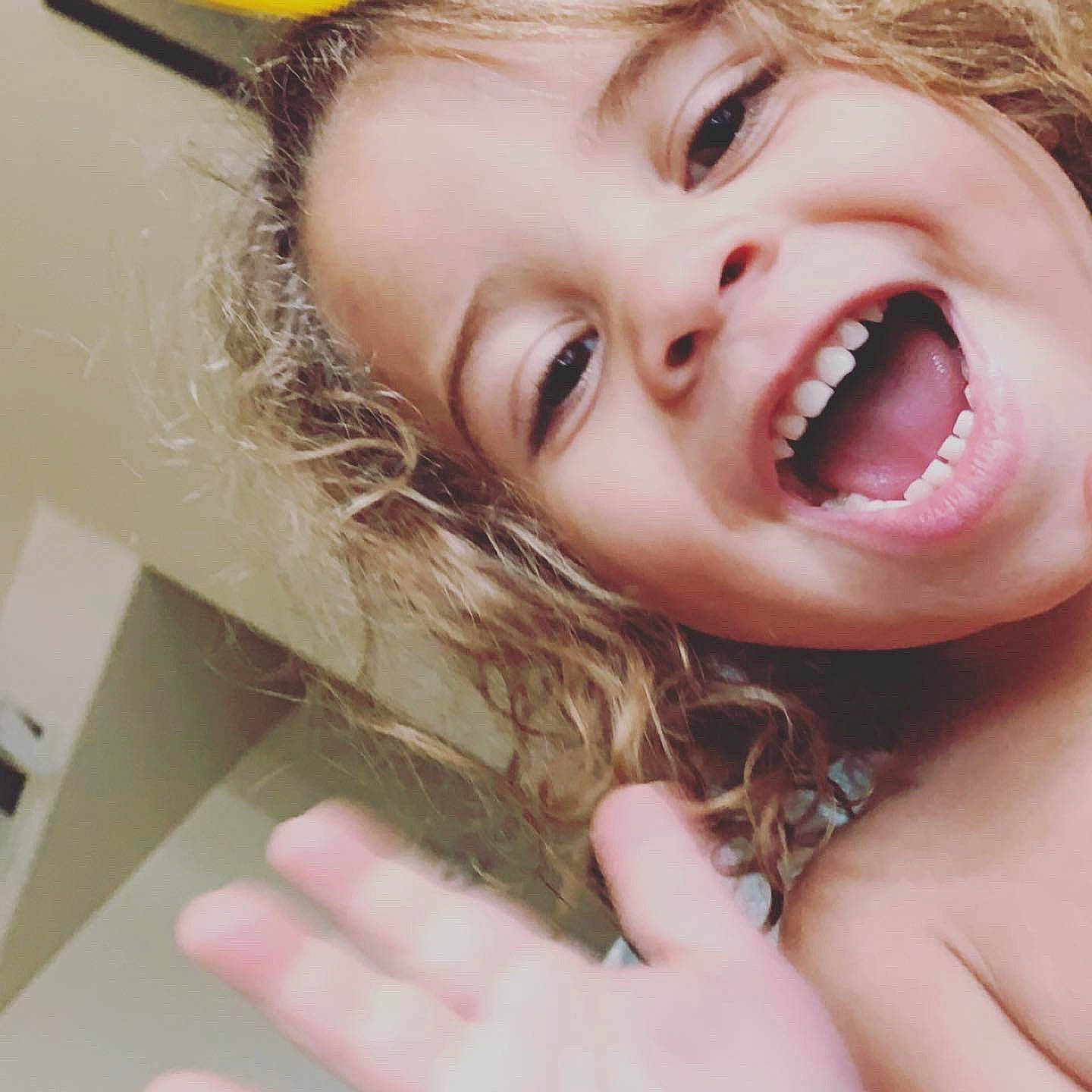 Justice is registered to the contest to win money with this photo: cheek, dress, ear, eye, eyelash, gesture, hair, happy, iris, jaw, layered_hair, lip, long_hair, mouth, nose, organ, person, skin, smile, toddler