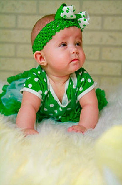 Natalie is registered to the contest to win money with this photo: baby, baby_toddler_clothing, child, costume_accessory, green, hair_accessory, headgear, person, toddler