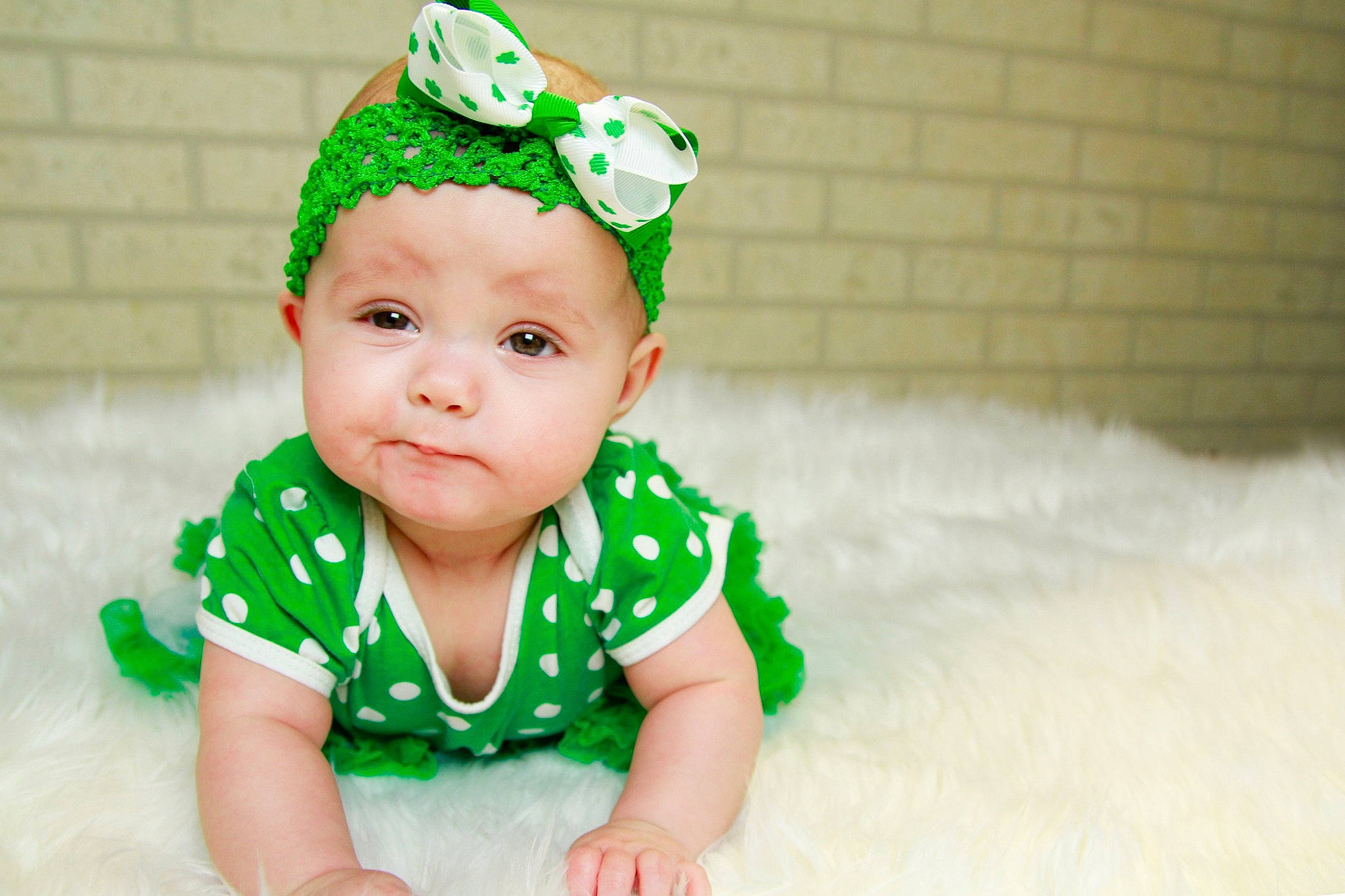 Natalie is registered to the contest to win money with this photo: baby, baby_bloomers, baby_toddler_clothing, child, costume_accessory, fashion_accessory, green, hair_accessory, headband, headgear, person, toddler