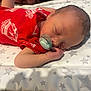 newborn, baby, infant, sleeping, pacifier, red_clothing, liverpool, football_club, blanket, stars, hand, face, head, skin, cute, peaceful, resting, indoors, portrait, child