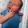 Reggie is registered to the contest to win money with this photo: newborn, baby, infant, blue_onesie, sleeping, hand, face, skin, blanket, star_pattern, peaceful, closeup, portrait, child, cute, resting, soft_light, indoors, human, toddler