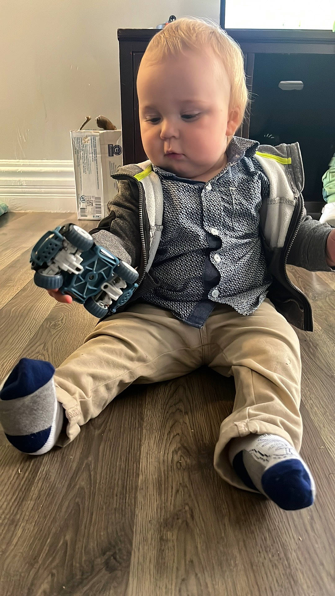 Axel joined the competition — help win amazing prizes! baby, baby_toddler_clothing, cheek, child, comfort, cool, face, floor, flooring, hairstyle, hardwood, pattern, person, plaid, shoe, skin, sleeve, sneakers, toddler, white
