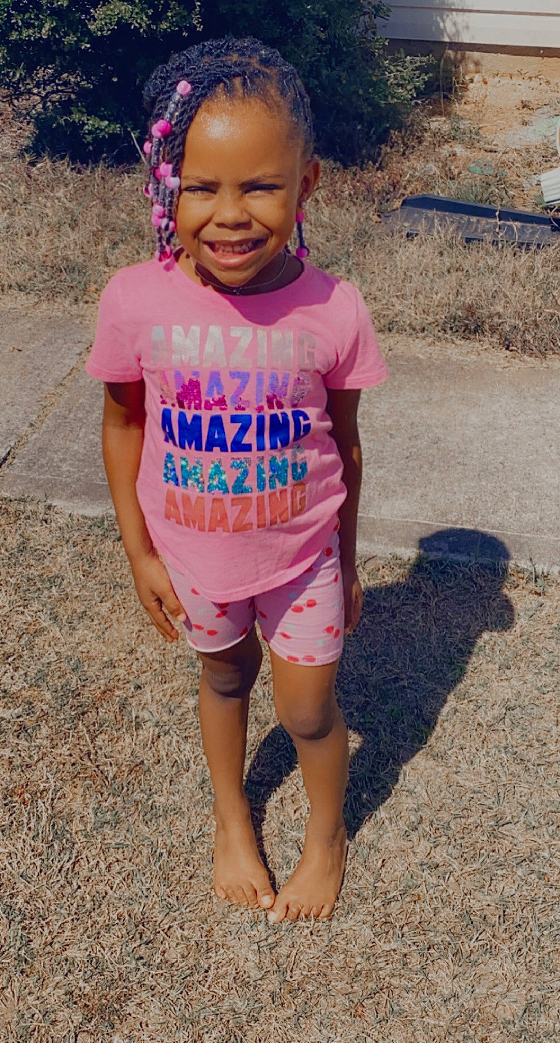 Kyndall is registered to the contest to win money with this photo: baby_toddler_clothing, child, clothing, cool, fun, grass, happy, headgear, jewellery, joy, leisure, magenta, person, personal_protective_equipment, pink, skin, sleeve, smile, t_shirt, thigh