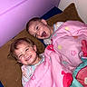 Memphys is registered to the contest to win money with this photo: bed, blanket, child, children, colorful, cozy, cute, face, family, fun, happy, indoor, laughing, pajamas, pillow, pink, playful, siblings, smiling, young