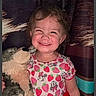 toddler, child, smiling, plush_toy, wolf, red_skirt, strawberry_shirt, curtain, indoor, happy, cute, portrait, clothing, person, young_child, toy, face, hair, cheerful, standing