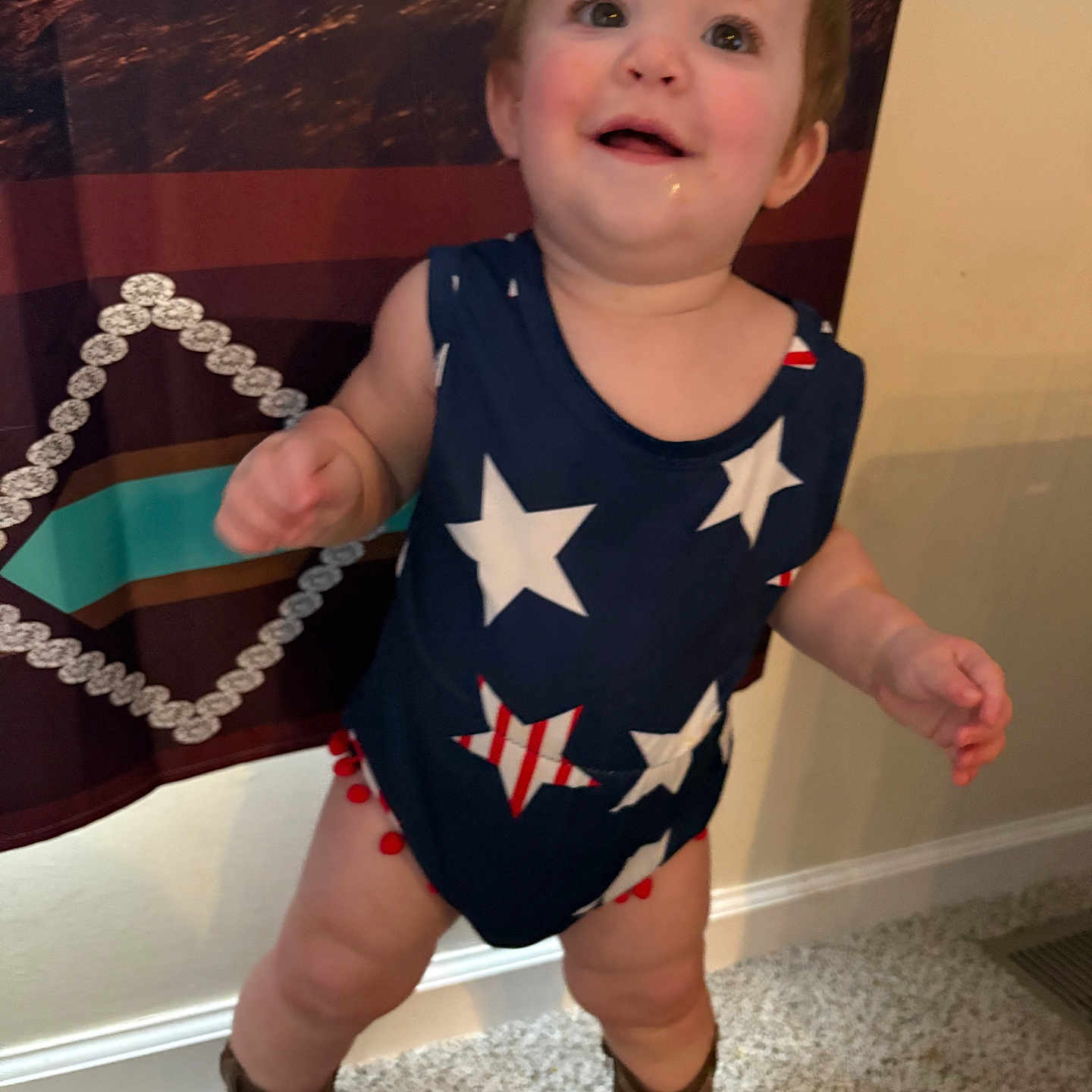 Espyn joined the competition — help win amazing prizes! toddler, child, indoor, carpet, curtain, clothing, boots, star_pattern, smiling, face, person, baby, happy, standing, pattern, wall, footwear, cute, young_child, room