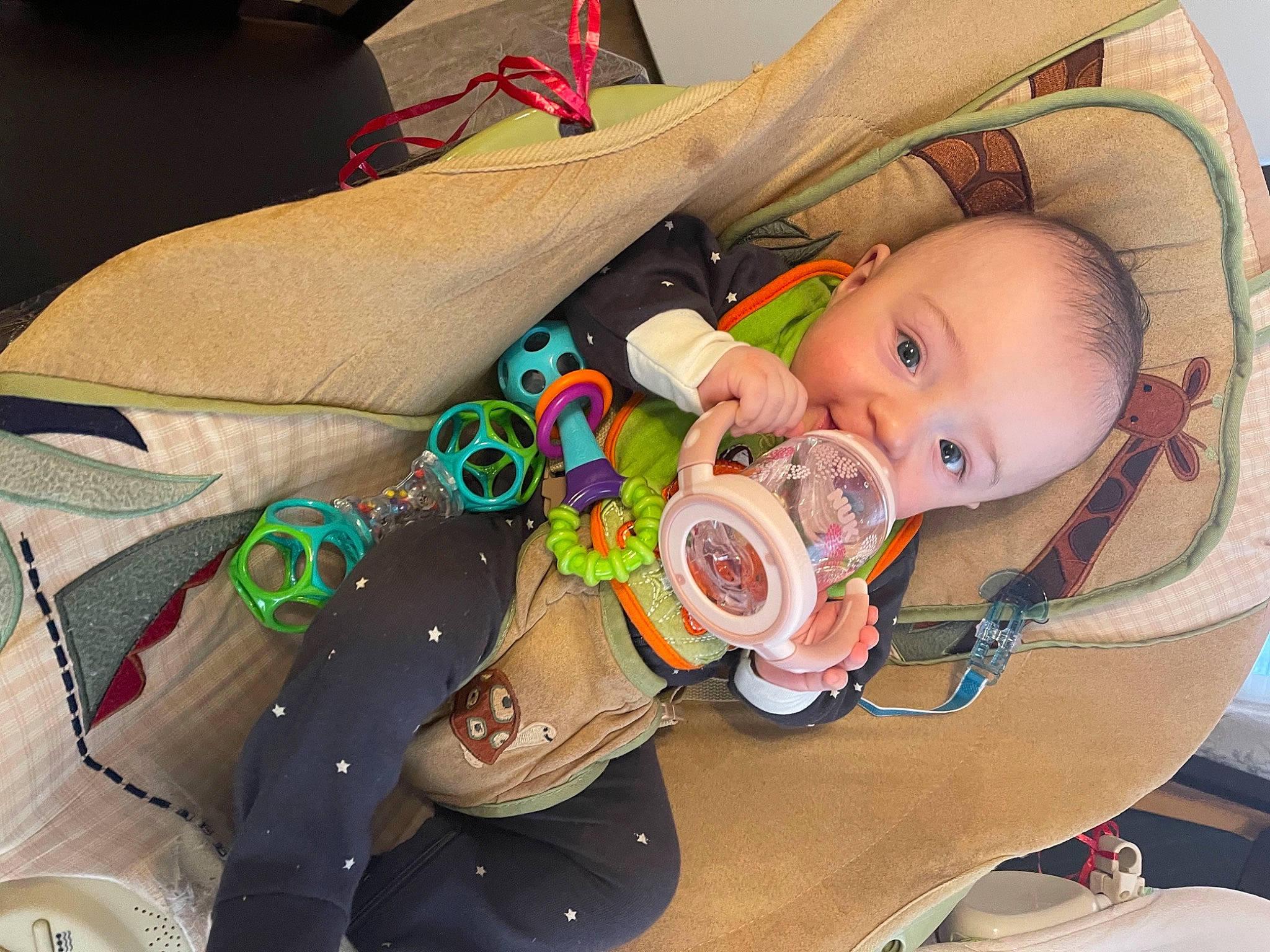Olivier is registered to the contest to win money with this photo: baby, baby_carriage, baby_products, baby_safety, baby_toddler_clothing, baby_toys, cheek, child, comfort, eye, human_body, infant_bed, iris, linens, person, plastic, room, sitting, toddler