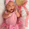 baby, infant, pink_dress, headband, bows, blanket, plaque, milestone, 3_months, portrait, smiling, cute, child, newborn, celebration, lying_down, hands, face, fabric, tulle