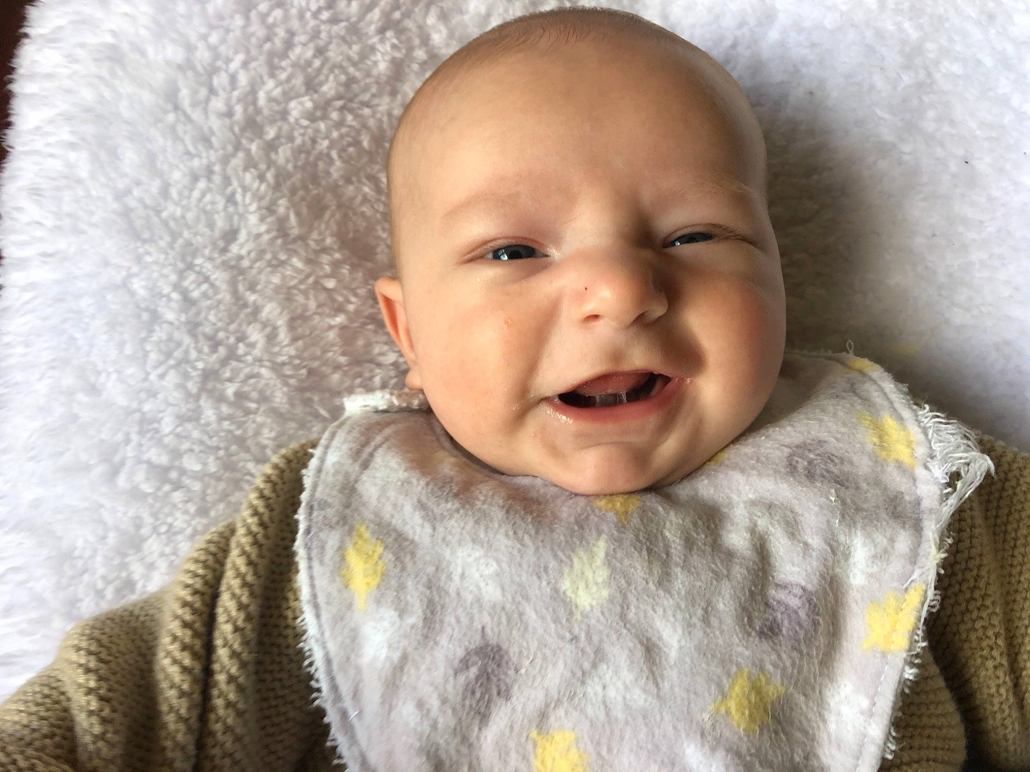 Oliver is registered to the contest to win money with this photo: baby, baby_toddler_clothing, cheek, chin, comfort, ear, eye, face, grey, head, iris, lip, mouth, neck, nose, outerwear, person, skin, sleeve, smile