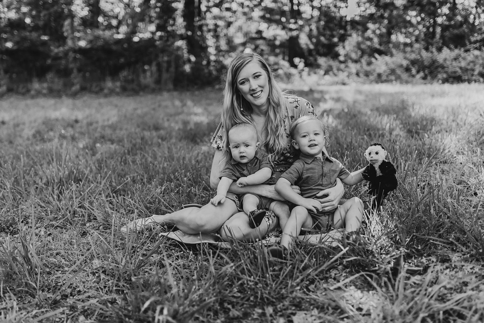 Cayton is registered to the contest to win money with this photo: black_and_white, child, family, fun, grass, joy, meadow, monochrome, monochrome_photography, people, people_in_nature, person, photograph, photography, portrait, portrait_photography, sibling, sitting, smile, snapshot