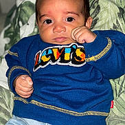 Vinnie-James is registered to the contest to win money with this photo: baby, blanket, child, clothing, cute, eyes, face, fashion, fist, hand, indoor, infant, jeans, levis, pattern, person, portrait, sitting, sweater, young
