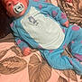Vinnie-James joined the competition — help win amazing prizes! baby, bed, blanket, blue_onesie, child, comfort, cute, hand, indoors, infant, leaf_pattern, lying_down, pacifier, person, purple_spots, resting, skin, sleepwear, soft_lighting, tattooed_hand