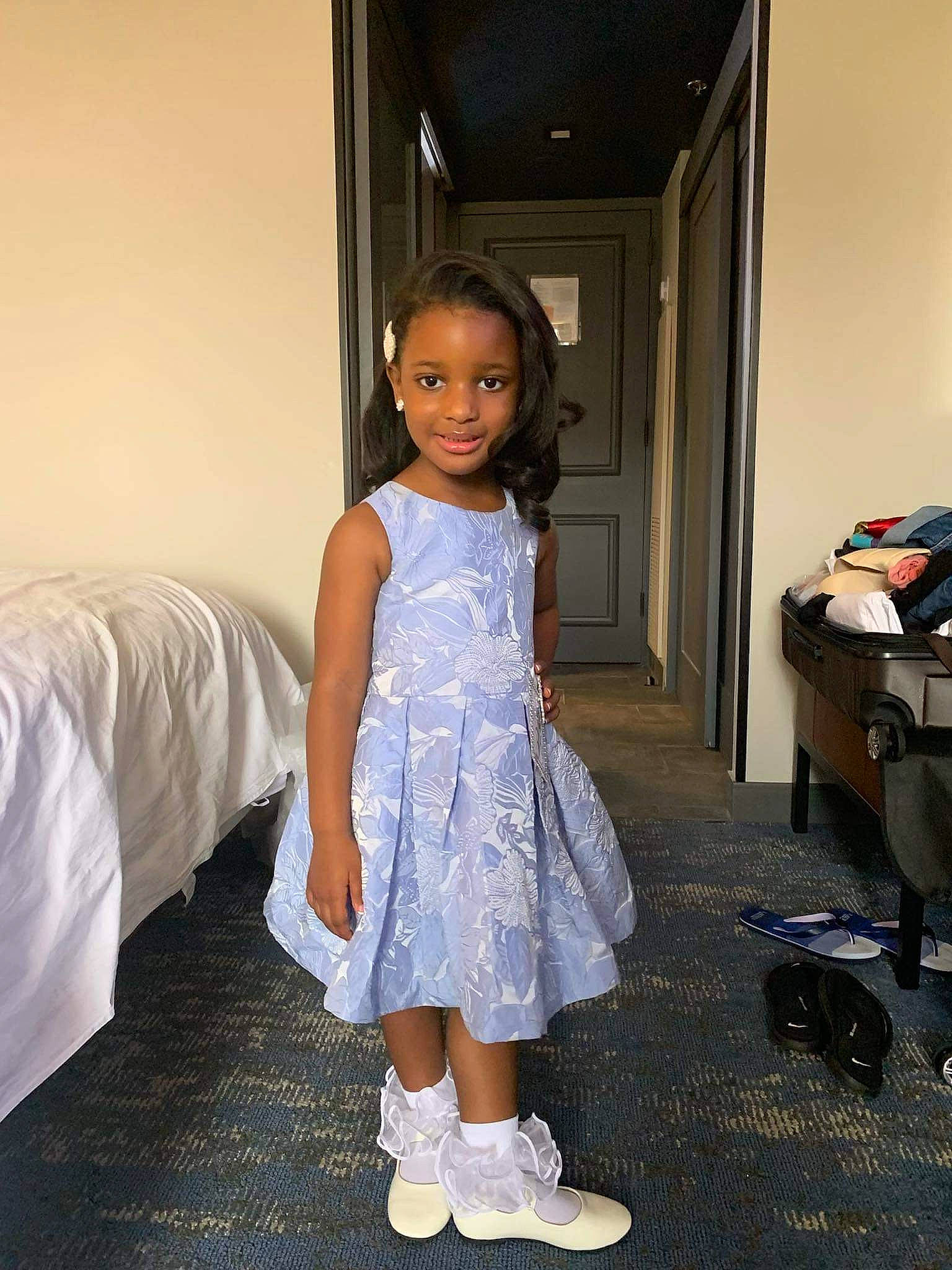 Kadence joined the competition — help win amazing prizes! baby_toddler_clothing, day_dress, dress, facial_expression, fashion_design, floor, flooring, formal_wear, fun, hairstyle, happy, joy, leg, luggage_and_bags, office_supplies, one_piece_garment, person, sleeve, smile, standing