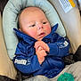 baby, blanket, blue_jacket, car_seat, casual, child, clothing, comfort, cute, face, hands, indoor, infant, pacifier, portrait, puma, seatbelt, sitting, soft, young