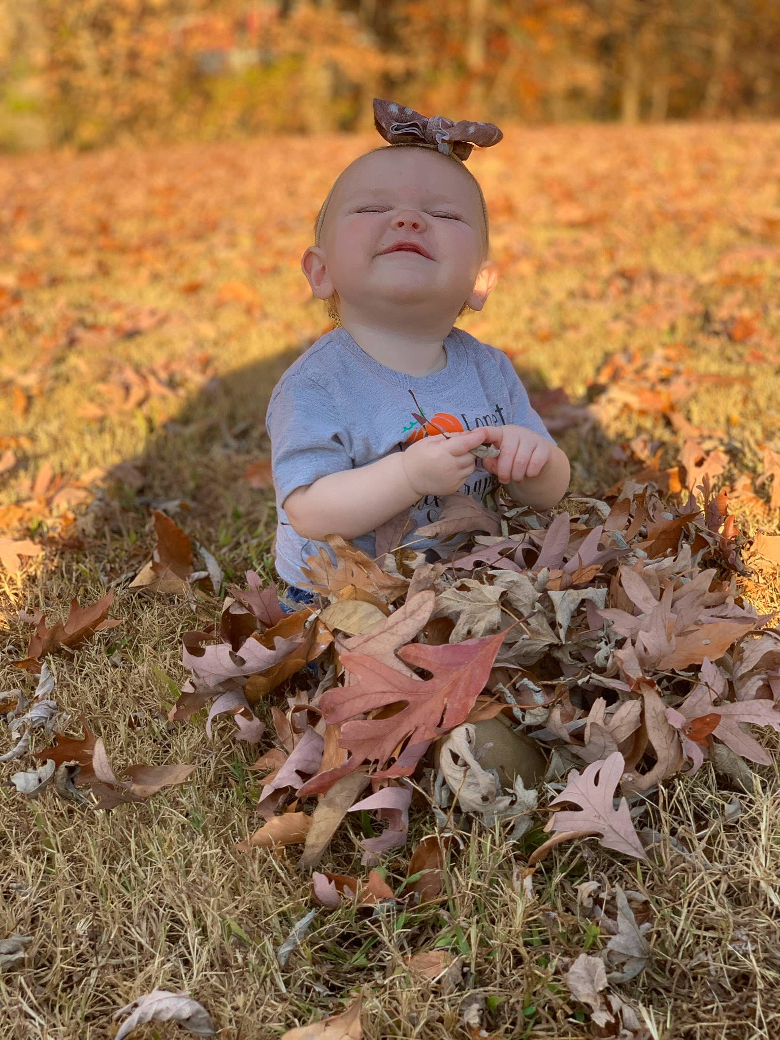Oaklee joined the competition — help win amazing prizes! adaptation, autumn, baby, child, deciduous, fawn, goggles, grass, groundcover, happy, hat, landscape, people_in_nature, person, plant, soil, sunglasses, toddler, toy, tree