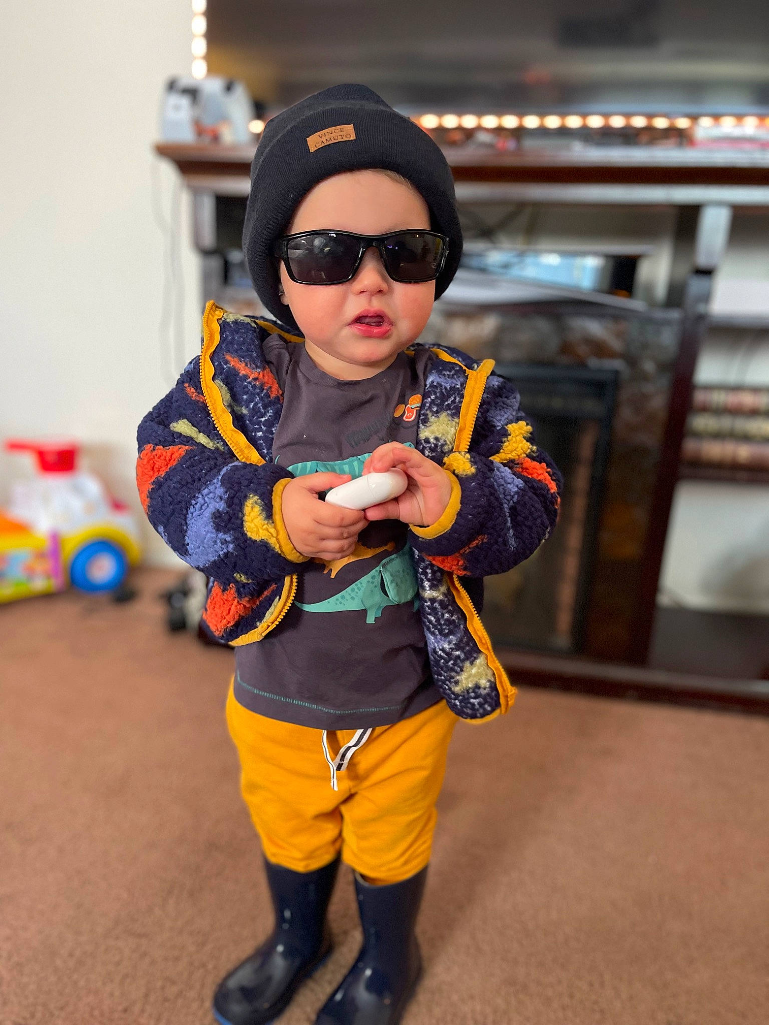 Conner is registered to the contest to win money with this photo: beanie, cap, child, costume, electric_blue, eyewear, fashion_accessory, fun, fur, glove, goggles, headgear, headwear, pattern, person, personal_protective_equipment, recreation, sleeve, sunglasses, t_shirt