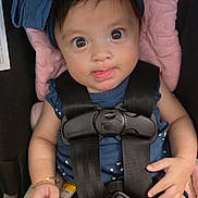 Shaliyah is registered to the contest to win money with this photo: baby, blue_bow, bracelet, car_seat, child, closeup, clothing, cute, expression, hands, headband, indoor, infant, person, pink_cushion, portrait, safety_harness, seatbelt, tongue_out, wide_eyes