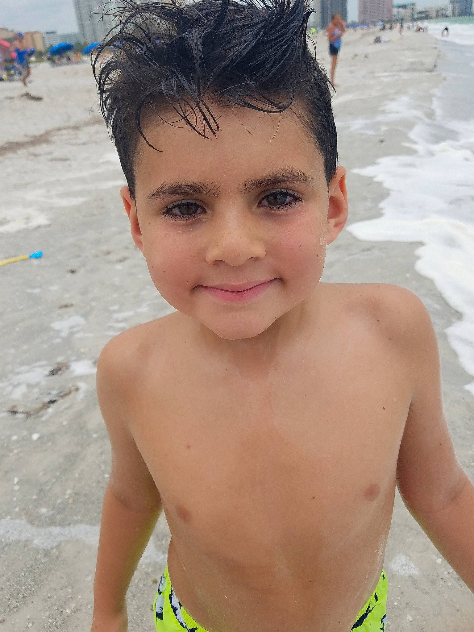 Johnny Boy is registered to the contest to win money with this photo: barechested, bathing, beach, black_hair, chest, child, face, facial_expression, forehead, fun, hair, head, joy, male, nose, person, skin, smile, summer, swimwear