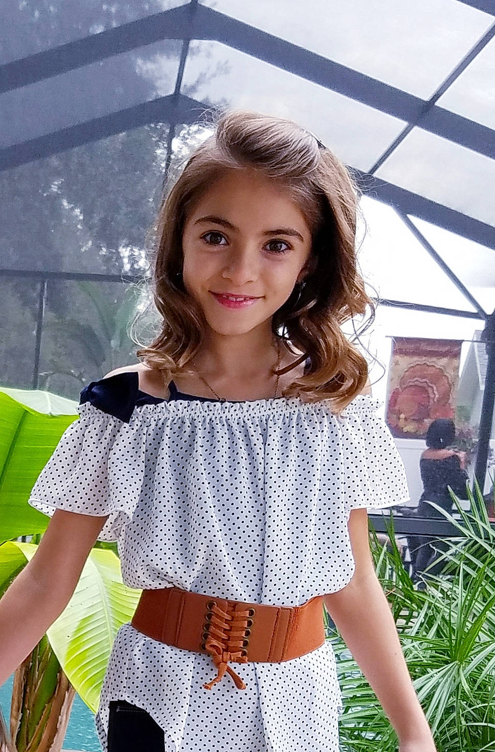 Toni is registered to the contest to win money with this photo: beauty, blouse, clothing, crop_top, design, dress, joint, joy, model, neck, pattern, person, photography, polka_dot, shirt, shoulder, sleeve, t_shirt, textile, top