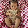 baby, infant, child, cute, heart_pattern, blanket, clothing, headband, legs, feet, hands, portrait, indoors, young_child, sitting, fabric, pattern, soft_lighting, skin, expression