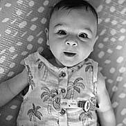 Hugo joined the competition — help win amazing prizes! baby, infant, face, eyes, clothing, pattern, blanket, lying_down, cute, portrait, sleeveless_shirt, palm_tree_pattern, buttoned_shirt, indoors, young_child, skin, expression, head, person, monochrome