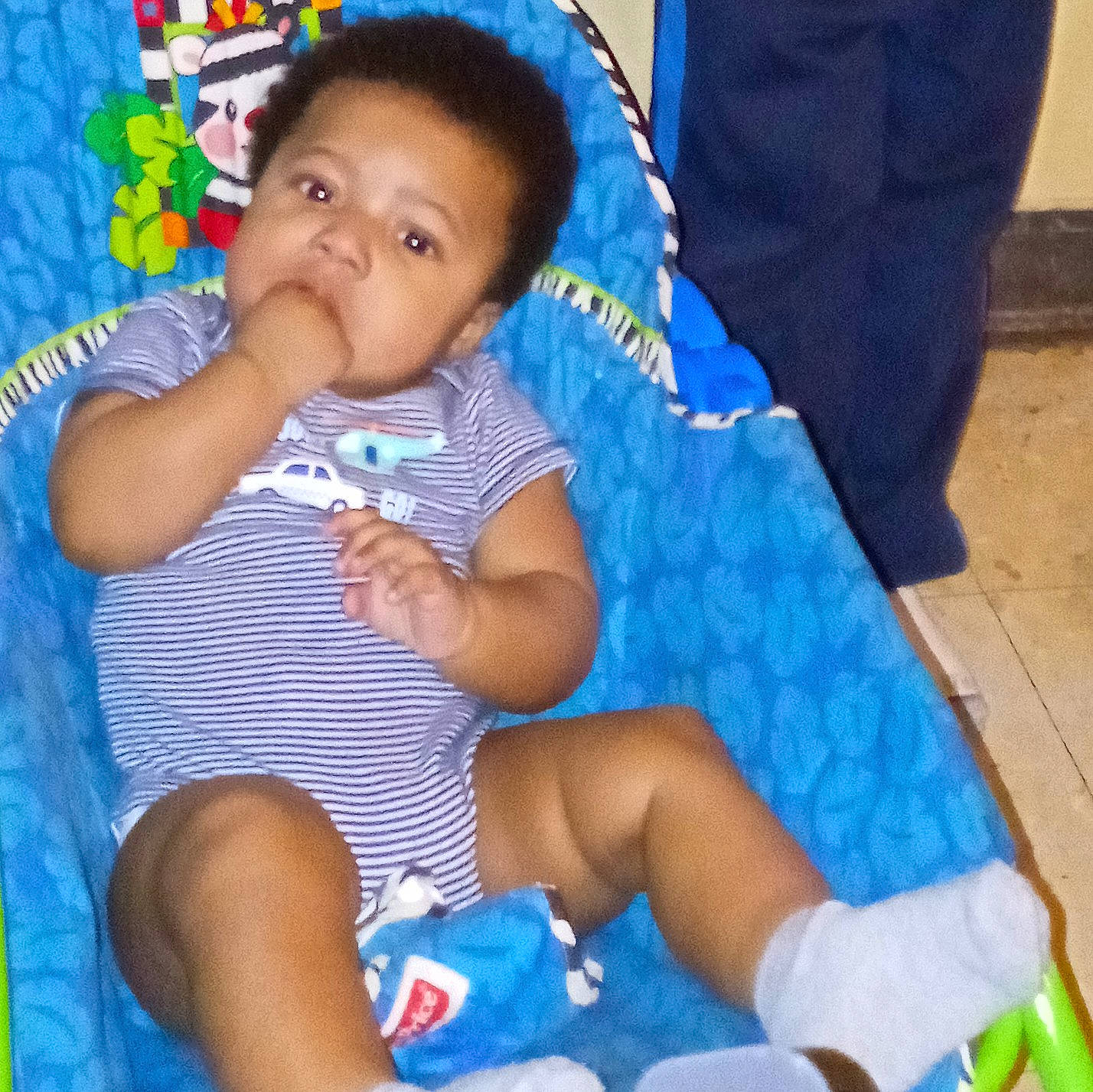 Darian is registered to the contest to win money with this photo: arm, baby, baby_products, baby_toddler_clothing, blue, child, comfort, finger, happy, human_body, human_leg, knee, lap, mouth, nail, person, skin, thigh, thumb, toddler