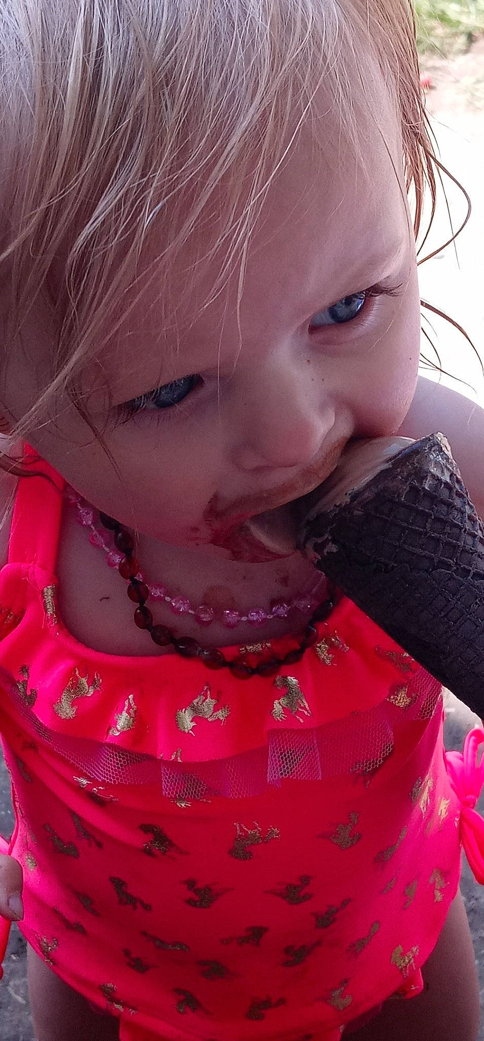 Molly is registered to the contest to win money with this photo: arm, baby_toddler_clothing, cheek, chin, eyelash, facial_expression, hair, hairstyle, hand, iris, lip, mouth, neck, nose, organ, outerwear, person, product, purple, skin