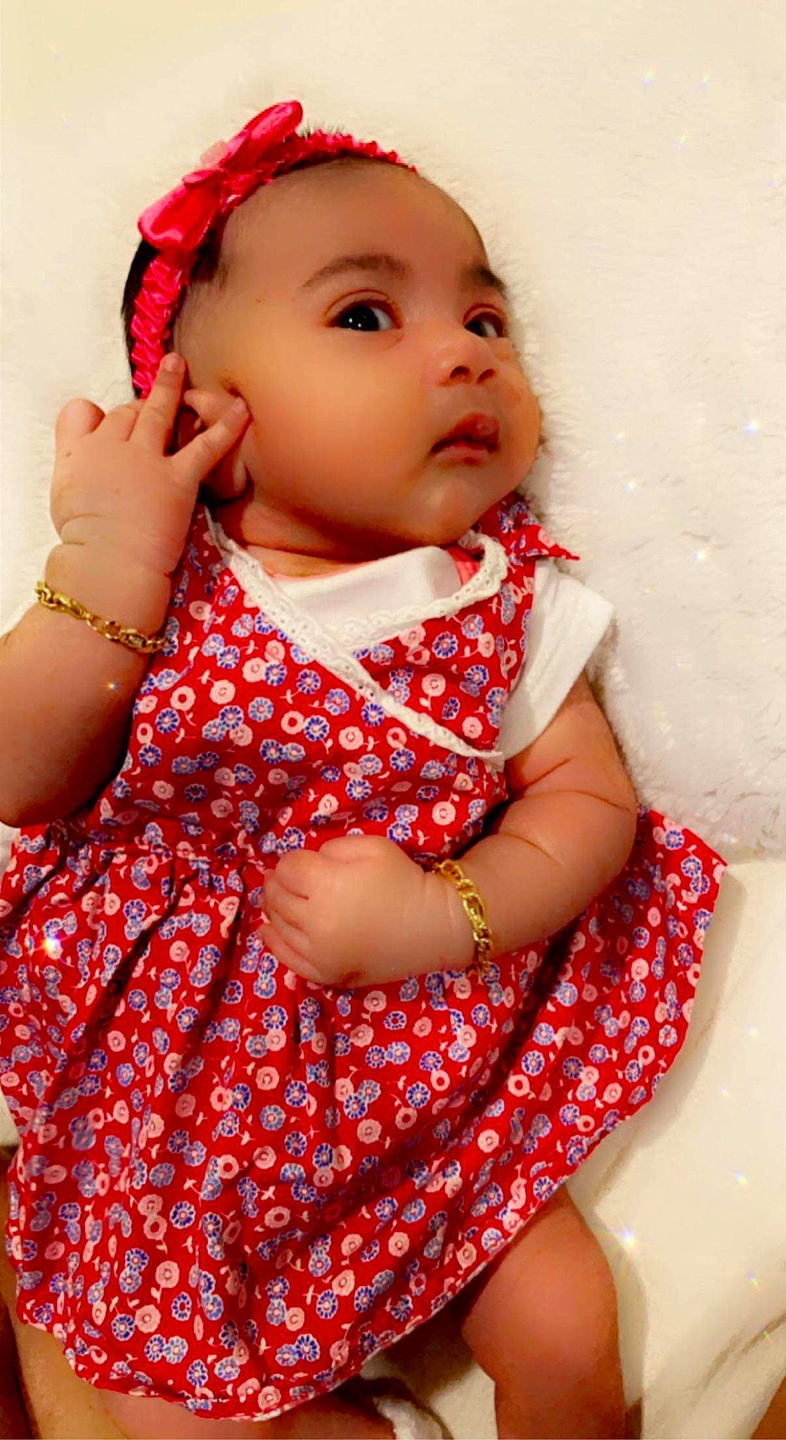 Naina is registered to the contest to win money with this photo: baby_toddler_clothing, cheek, collar, day_dress, dress, face, facial_expression, finger, gesture, hand, happy, lip, neck, one_piece_garment, person, pink, red, shoulder, skin, sleeve