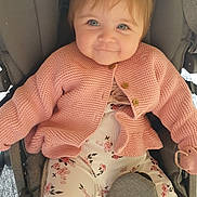 Bonnie joined the competition — help win amazing prizes! baby, blue_eyes, child, clothing, comfort, cute, cute_expression, face, floral_pants, happy, indoor, infant, knitted, pacifier, person, pink_cardigan, seated, smiling, soft_lighting, stroller