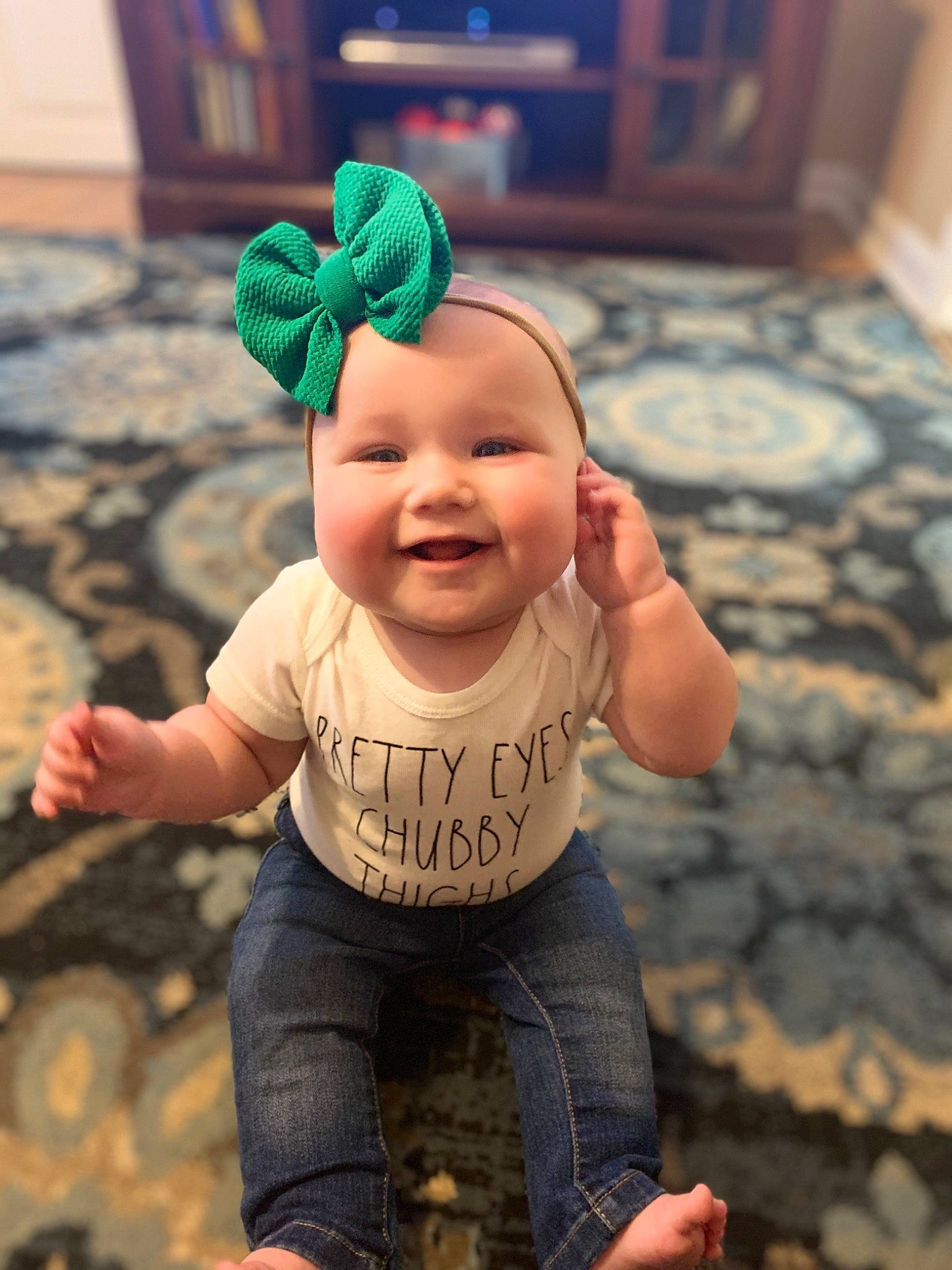 Kenzleigh is registered to the contest to win money with this photo: baby, baby_laughing, baby_products, baby_toddler_clothing, cheek, child, costume_accessory, denim, eye, facial_expression, finger, floor, flooring, headwear, joy, mouth, nose, organ, person, skin