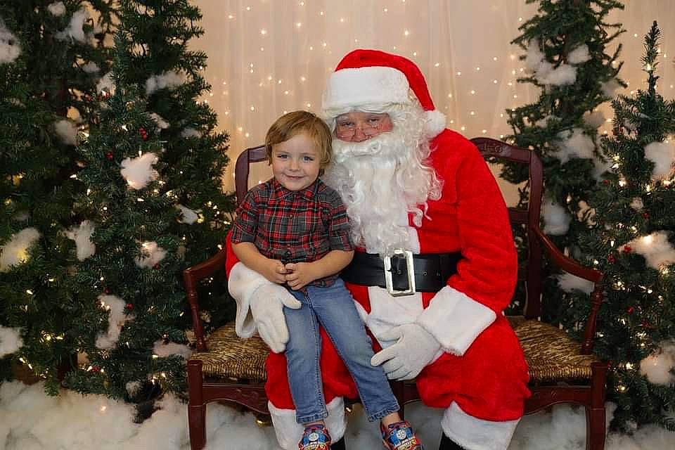 Lukas is registered to the contest to win money with this photo: beard, carmine, christmas, christmas_decoration, christmas_eve, christmas_ornament, christmas_tree, event, facial_hair, fictional_character, happy, headwear, holiday, human, human_body, interior_design, joy, person, red, santa_claus