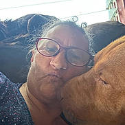 Big Bear is registered to the contest to win money with this photo: affection, casual, closeup, collar, couch, dog, face, glasses, hair, indoor, light, love, nose, pet, portrait, relax, selfie, skin, window, woman