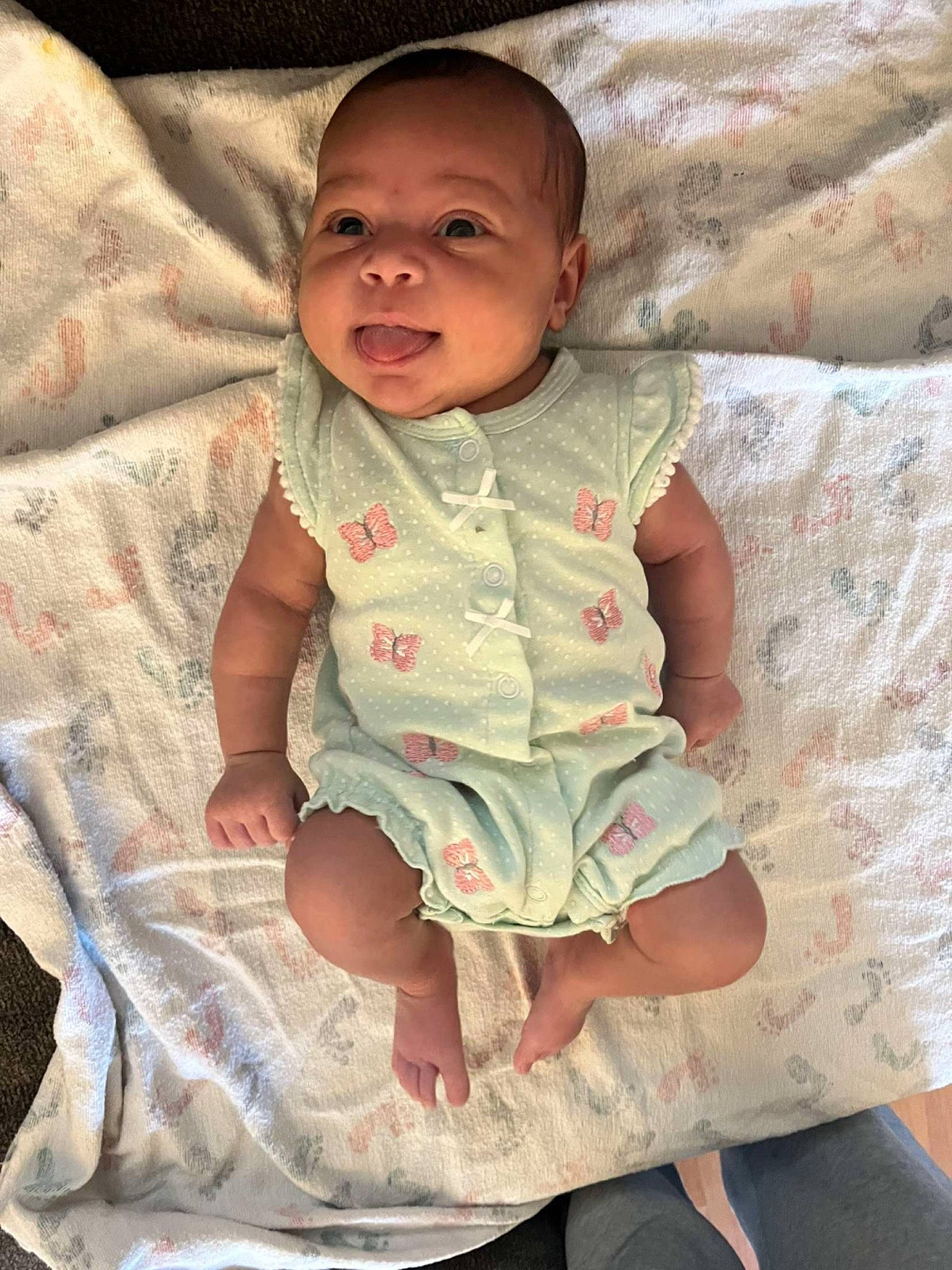 Amyra is registered to the contest to win money with this photo: baby, baby_toddler_clothing, cheek, child, comfort, dress, eye, face, finger, happy, head, human_body, iris, linens, nose, pattern, person, pink, skin, sleeve