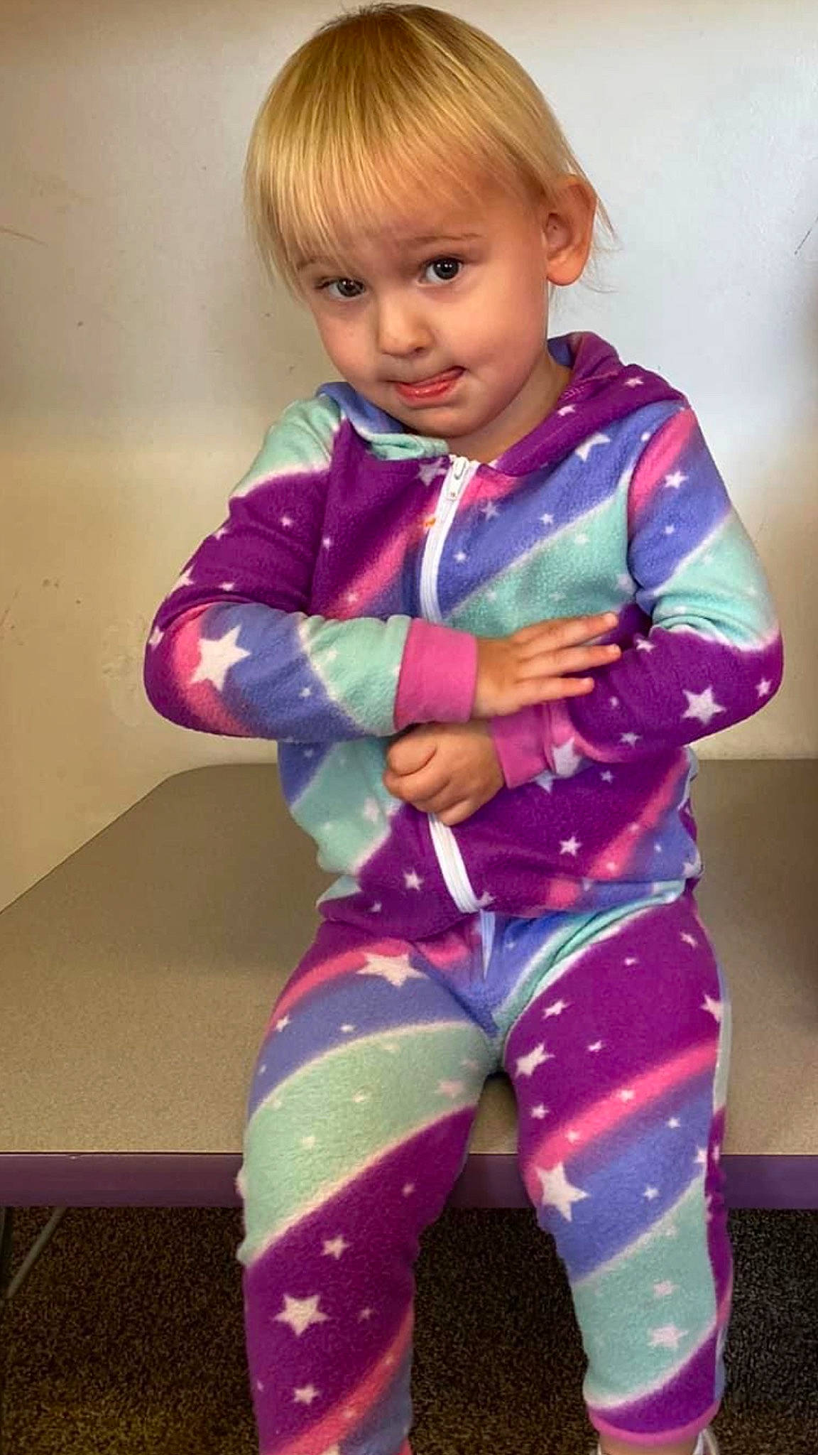 Kailena is registered to the contest to win money with this photo: baby, baby_toddler_clothing, bangs, blond, brown_hair, child, electric_blue, face, fun, gesture, happy, head, magenta, pattern, person, pink, purple, sleeve, t_shirt, toddler