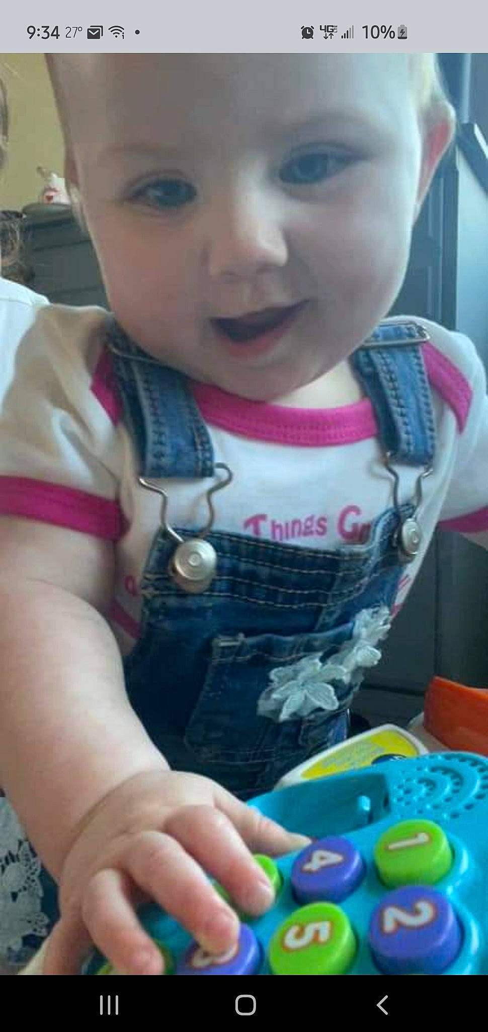 Halle is registered to the contest to win money with this photo: arm, baby_toddler_clothing, blue, cheek, eye, eyelash, face, green, hand, headwear, human_body, lip, mouth, neck, nose, person, photograph, product, skin, sleeve