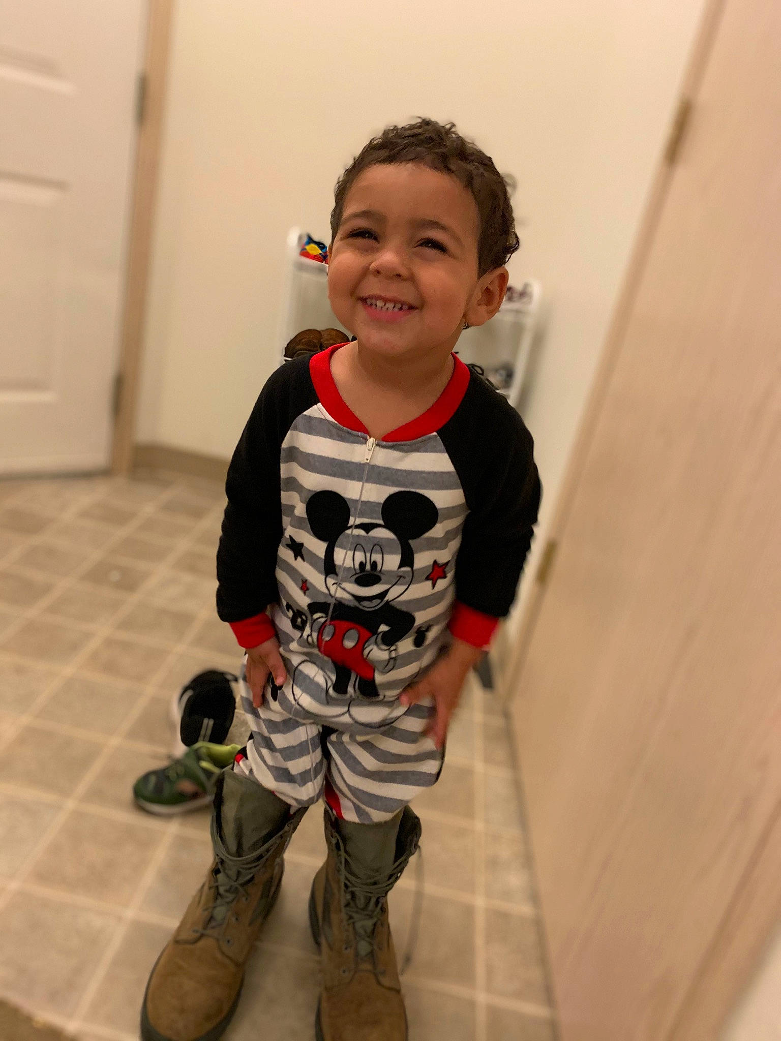 Izaiah is registered to the contest to win money with this photo: cheek, child, face, head, joy, person, shoe, skin, sleeve, smile, t_shirt, toddler