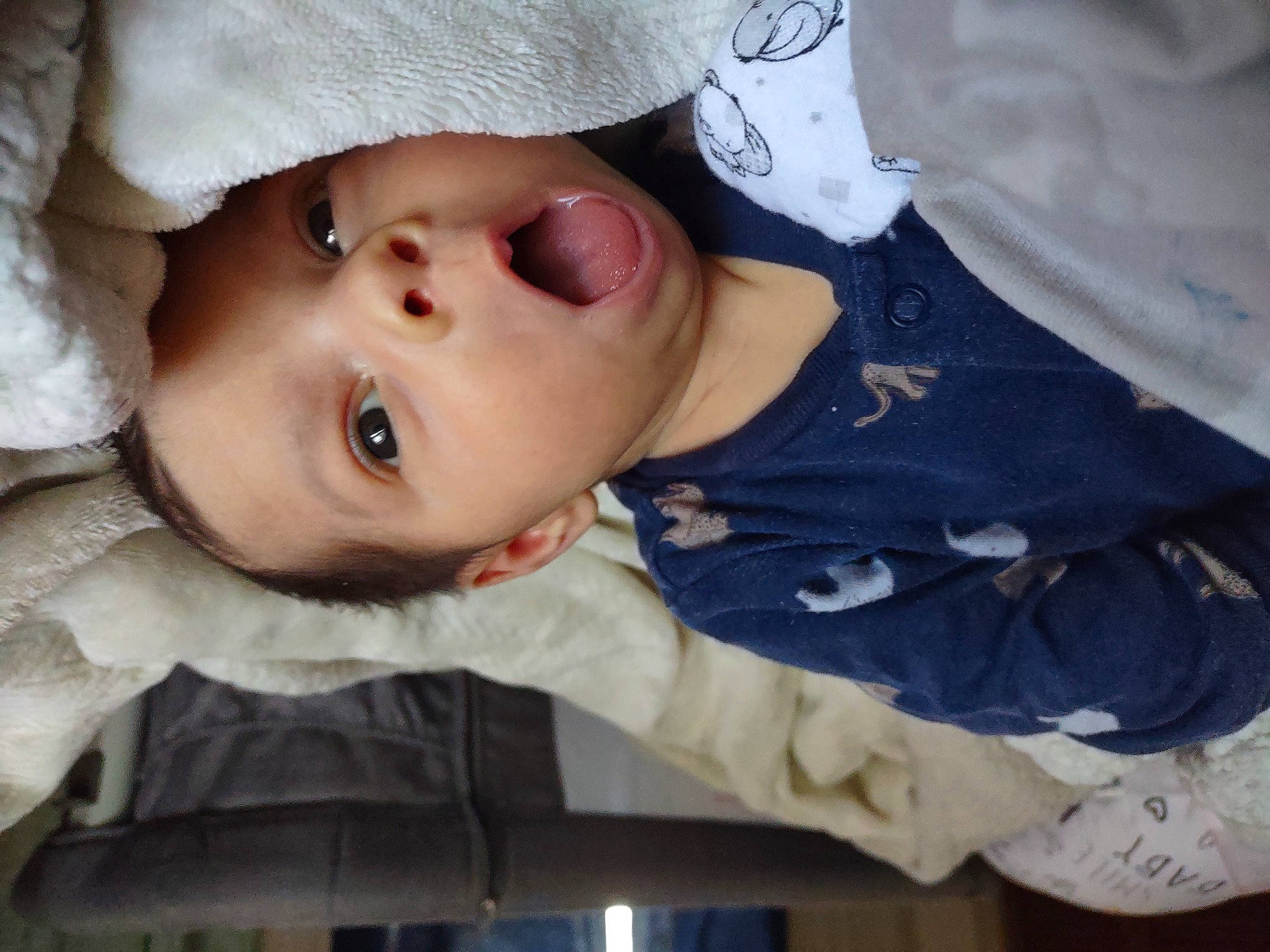 Zackary joined the competition — help win amazing prizes! baby, baby_toddler_clothing, cap, cheek, child, eyelash, face, happy, hat, human_body, iris, lip, nose, outerwear, person, sitting, skin, sleeve, surprise, toddler