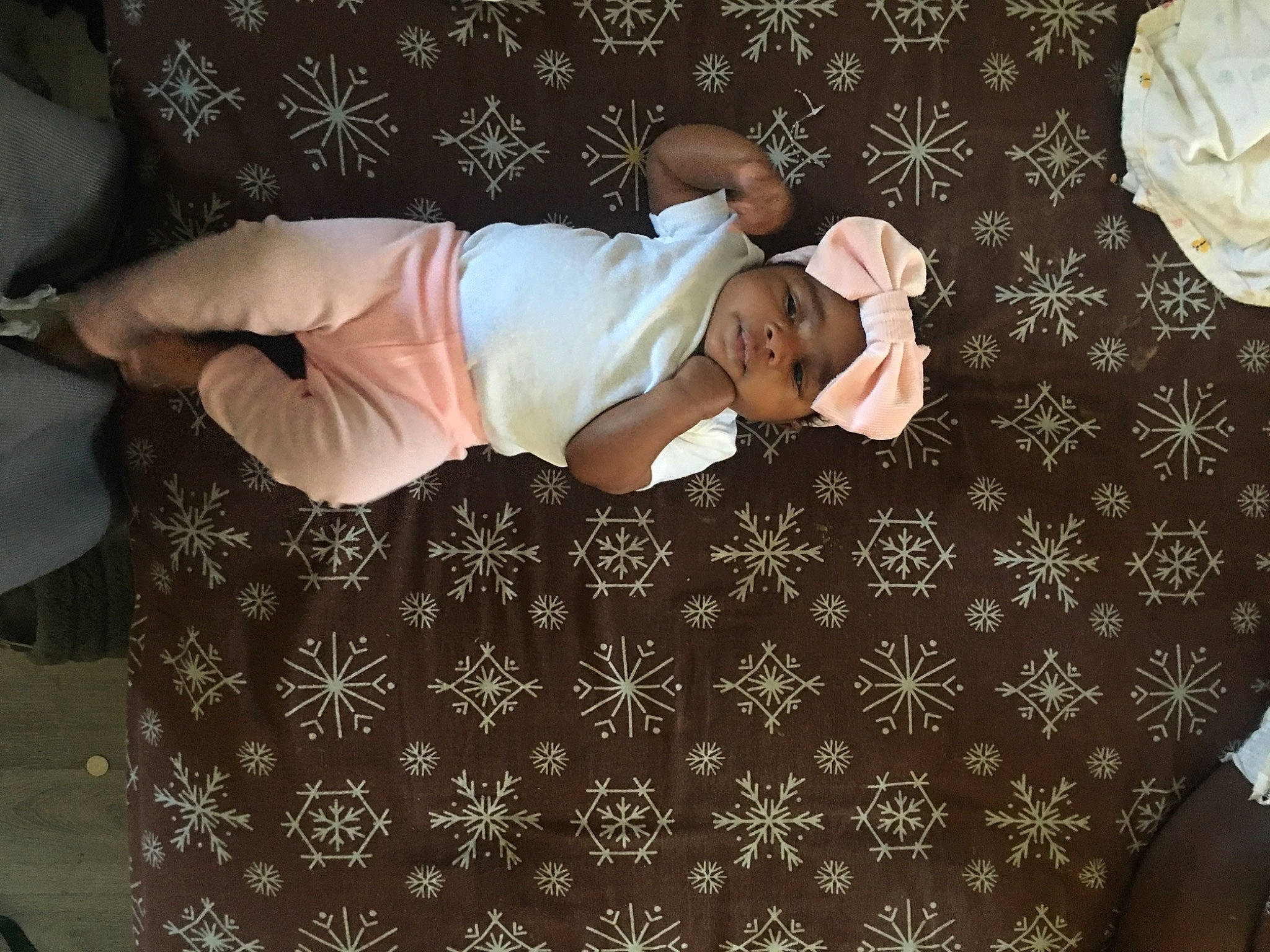 Legacy is registered to the contest to win money with this photo: baby, baby_products, baby_sleeping, baby_toddler_clothing, bed, bed_sheet, bedding, child, comfort, hat, headwear, human_leg, linens, nap, pattern, person, room, sleeve, t_shirt, textile