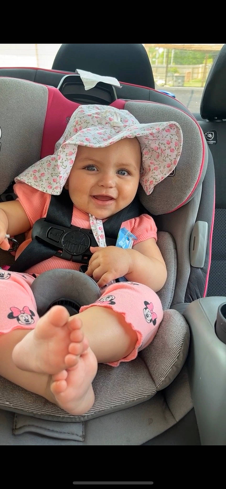 Ellianna is registered to the contest to win money with this photo: automotive_design, baby, baby_toddler_clothing, beauty, car, car_seat, car_seat_cover, child, comfort, finger, happy, headwear, joy, lap, motor_vehicle, person, pink, product, skin, smile