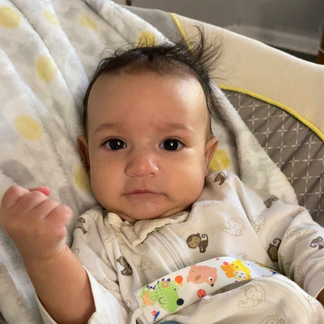 Cameron is registered to the contest to win money with this photo: applique, architecture, baby, bed, bedroom, blanket, bodypart, building, clothing, couch, cradle, crib, cushion, cutlery, face, finger, furniture, hand, happy, head