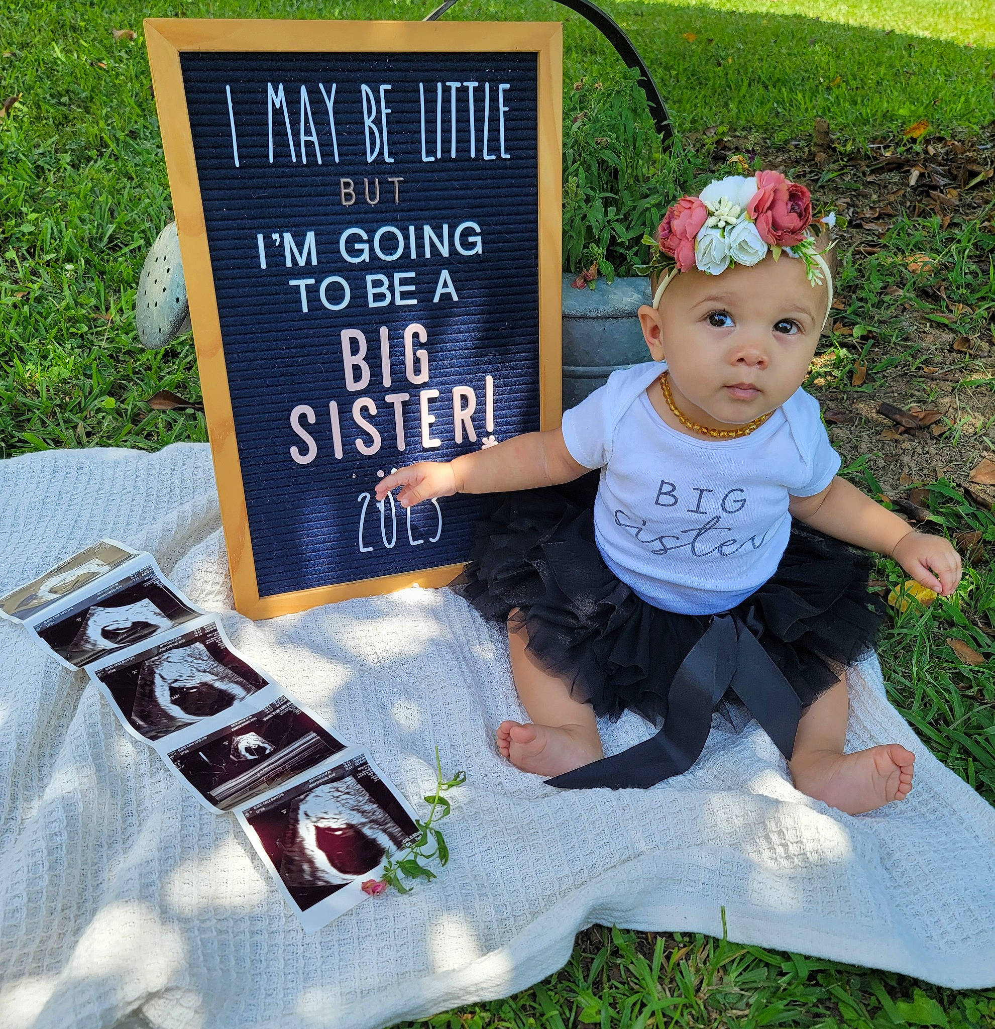 Galilee joined the competition — help win amazing prizes! advertising, baby, baby_toddler_clothing, child, fashion_accessory, flower, font, fun, grass, happy, hat, headband, headpiece, headwear, lawn, party_supply, person, plant, sitting, sleeve