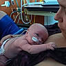 Damon joined the competition — help win amazing prizes! baby, newborn, hospital, medical_tubes, woman, holding, care, love, skin_to_skin, intensive_care, infant, patient, healthcare, monitoring, medical_equipment, tenderness, comfort, face, portrait, resting