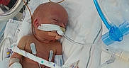 Damon is registered to the contest to win money with this photo: newborn, baby, incubator, hospital, medical_tubes, monitoring_devices, blanket, heart_pattern, bandages, electrodes, infant, healthcare, patient, premature, resting, medical_care, hospital_bed, respirator, swaddled, tiny